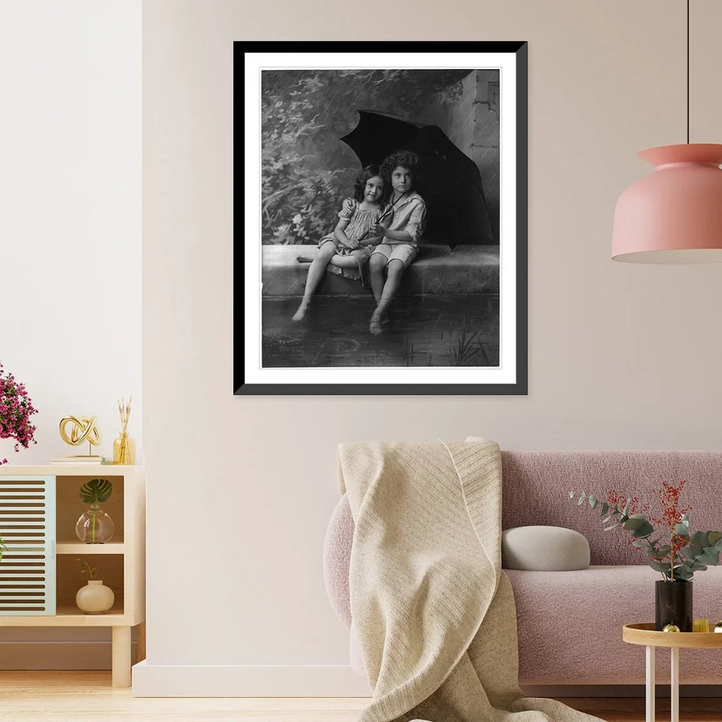 Historic Framed Print, [2 children on fountain wall, under umbrella in rain], 17-7/8" x 21-7/8"